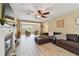 Open living space with a cozy fireplace, wood-look floors, and an inviting seating area at 3673 Fremantle Dr, Palm Harbor, FL 34684