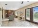 Cozy living room featuring wood-look floors, neutral paint, and plantation shutters at 3673 Fremantle Dr, Palm Harbor, FL 34684