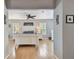Bright, neutral main bedroom featuring laminate floors, natural light, and light furnishings at 3673 Fremantle Dr, Palm Harbor, FL 34684