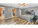 Primary bedroom with an attached bathroom and walk-in closet that features built-in shelving at 37331 Hickory Hill Ln, Dade City, FL 33525