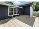 Charming front porch area with tiled flooring, white picket fence, and seating area for relaxing at 37331 Hickory Hill Ln, Dade City, FL 33525