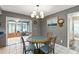 Cozy dining area with adjacent sunroom offers tile flooring and natural light at 37331 Hickory Hill Ln, Dade City, FL 33525