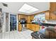 Kitchen with stainless appliances, tile flooring and black countertops at 37331 Hickory Hill Ln, Dade City, FL 33525