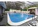 An inviting in-ground pool is surrounded by a screened enclosure with an adjacent gazebo at 37331 Hickory Hill Ln, Dade City, FL 33525