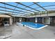 A refreshing pool is surrounded by a screened enclosure for outdoor relaxation and entertainment at 37331 Hickory Hill Ln, Dade City, FL 33525