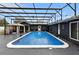 A relaxing in-ground pool with screened enclosure and a gazebo for outdoor entertaining at 37331 Hickory Hill Ln, Dade City, FL 33525
