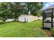The storage shed is located next to a fence and pool with lawn at 37331 Hickory Hill Ln, Dade City, FL 33525