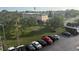 Community aerial showcasing lush greenery, ample parking, and well-maintained buildings at 4137 Lake Bayshore Dr # C505, Bradenton, FL 34205