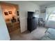 Comfortable bedroom featuring a black dresser and an adjacent sunny window overlooking the lake at 4137 Lake Bayshore Dr # C505, Bradenton, FL 34205
