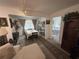 Open-concept dining area adjacent to living room, with view into the adjacent bedroom at 4137 Lake Bayshore Dr # C505, Bradenton, FL 34205