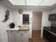 Bright kitchen with white cabinets, tile flooring, breakfast nook, and overhead lighting at 4137 Lake Bayshore Dr # C505, Bradenton, FL 34205