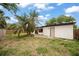 Backyard featuring a patio area, a lush lawn, and a wooden fence at 4650 87Th N Ter, Pinellas Park, FL 33782