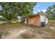 Traditional house exterior, showcasing a driveway and mature tree at 4650 87Th N Ter, Pinellas Park, FL 33782