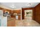 Bright kitchen featuring tile floors, wood cabinets, and modern appliances, next to a dining area at 4650 87Th N Ter, Pinellas Park, FL 33782
