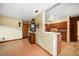 Open floor plan showcasing the living room and kitchen, with wood floors and neutral color palette at 4650 87Th N Ter, Pinellas Park, FL 33782
