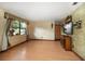 Open living room with wood floors, textured walls, and large window, offering great natural light at 4650 87Th N Ter, Pinellas Park, FL 33782