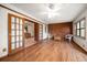 Spacious living room with wood-style floors and double doors leading to the kitchen at 4650 87Th N Ter, Pinellas Park, FL 33782