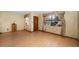 The living room has light walls, wood floors, and a window letting in natural light at 4650 87Th N Ter, Pinellas Park, FL 33782