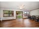 Open living room showcasing wood floors, large windows, and access to the backyard at 4650 87Th N Ter, Pinellas Park, FL 33782