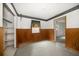 Empty room featuring wood paneling, a window, and access to a closet at 4650 87Th N Ter, Pinellas Park, FL 33782