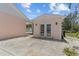 Rear view of a boathouse that includes double doors for access and storage solutions at 4749 Baywood Point S Dr, Gulfport, FL 33711