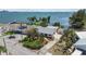 Charming waterfront home with lush landscaping, a spacious driveway, and picturesque water views at 4749 Baywood Point S Dr, Gulfport, FL 33711