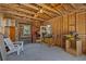 Spacious garage with wooden walls and rafters, featuring a work area and natural light at 4749 Baywood Point S Dr, Gulfport, FL 33711