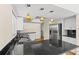 The kitchen has granite countertops, stainless steel appliances, and stylish pendant lighting at 4749 Baywood Point S Dr, Gulfport, FL 33711