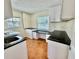 Functional laundry room with granite countertops, custom cabinets and natural light at 4749 Baywood Point S Dr, Gulfport, FL 33711