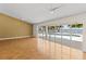 Open living area with pool and water views seen through expansive sliding glass doors at 4749 Baywood Point S Dr, Gulfport, FL 33711