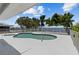 Enjoy a refreshing dip in the fenced in kidney shaped pool, perfect for outdoor relaxation at 4749 Baywood Point S Dr, Gulfport, FL 33711