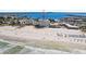 Expansive beach aerial showcasing condo and waterfront with gorgeous ocean view at 4950 Gulf Blvd # 404, St Pete Beach, FL 33706
