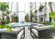 Refreshing fountain surrounded by lush courtyard with modern outdoor seating at 4950 Gulf Blvd # 404, St Pete Beach, FL 33706