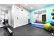 Fully equipped gym with various workout machines and free weights; perfect for fitness enthusiasts at 4950 Gulf Blvd # 404, St Pete Beach, FL 33706