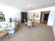Cozy living area with dining space, neutral tones and comfortable seating at 4950 Gulf Blvd # 404, St Pete Beach, FL 33706