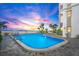 Relaxing pool area with ocean view and palm trees. Beachfront property at 4950 Gulf Blvd # 404, St Pete Beach, FL 33706