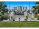 Elegant Beau Monde signage amidst manicured landscaping and lush greenery at 4950 Gulf Blvd # 404, St Pete Beach, FL 33706
