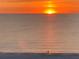 Tranquil sunset view over the water, casting a warm glow on the horizon at 4950 Gulf Blvd # 404, St Pete Beach, FL 33706