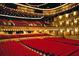 Ornate theater with red velvet seating and layered balcony overlooking the stage, offering a luxurious experience at 4950 Gulf Blvd # 404, St Pete Beach, FL 33706