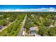 Aerial view of the property with a tree-lined street leading to the city skyline at 5005 Tangerine S Ave, Gulfport, FL 33707