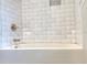 Modern bathtub with white subway tile surround and updated fixtures at 5005 Tangerine S Ave, Gulfport, FL 33707