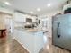 Modern kitchen with granite countertops, stainless steel appliances, and wood flooring at 5005 Tangerine S Ave, Gulfport, FL 33707