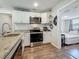 Well-appointed kitchen with granite counters, stainless appliances, and modern finishes at 5005 Tangerine S Ave, Gulfport, FL 33707