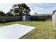 Backyard featuring a shed, a concrete patio, and a wood fence at 5151 7Th N Ave, St Petersburg, FL 33710