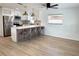 Bright kitchen featuring stainless appliances, a breakfast bar with seating, and modern pendant lights at 5151 7Th N Ave, St Petersburg, FL 33710