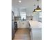 Renovated kitchen featuring white cabinetry, stainless steel appliances, and quartz countertops at 5151 7Th N Ave, St Petersburg, FL 33710