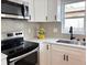 Close up shot of the newly renovated kitchen including stainless steel appliances and granite countertops at 5151 7Th N Ave, St Petersburg, FL 33710