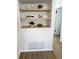 This shelf design has three shelves and is built into the wall over a painted brick feature wall at 5151 7Th N Ave, St Petersburg, FL 33710