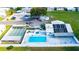 Aerial view of clubhouse, pool, hot tub, and community at 5451 Antigua Dr, Zephyrhills, FL 33541