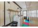 Features a laundry room with washer, dryer, and shelving at 5451 Antigua Dr, Zephyrhills, FL 33541